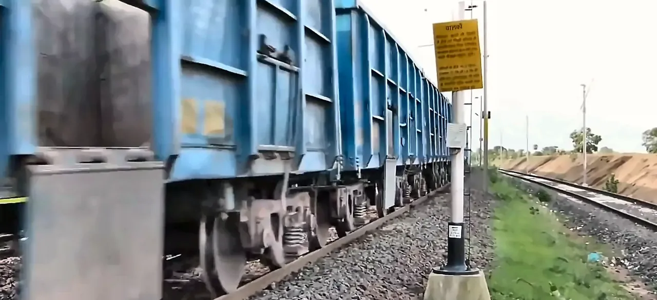 Freight train wagons running on a railway line, from the IRCON International corporate film