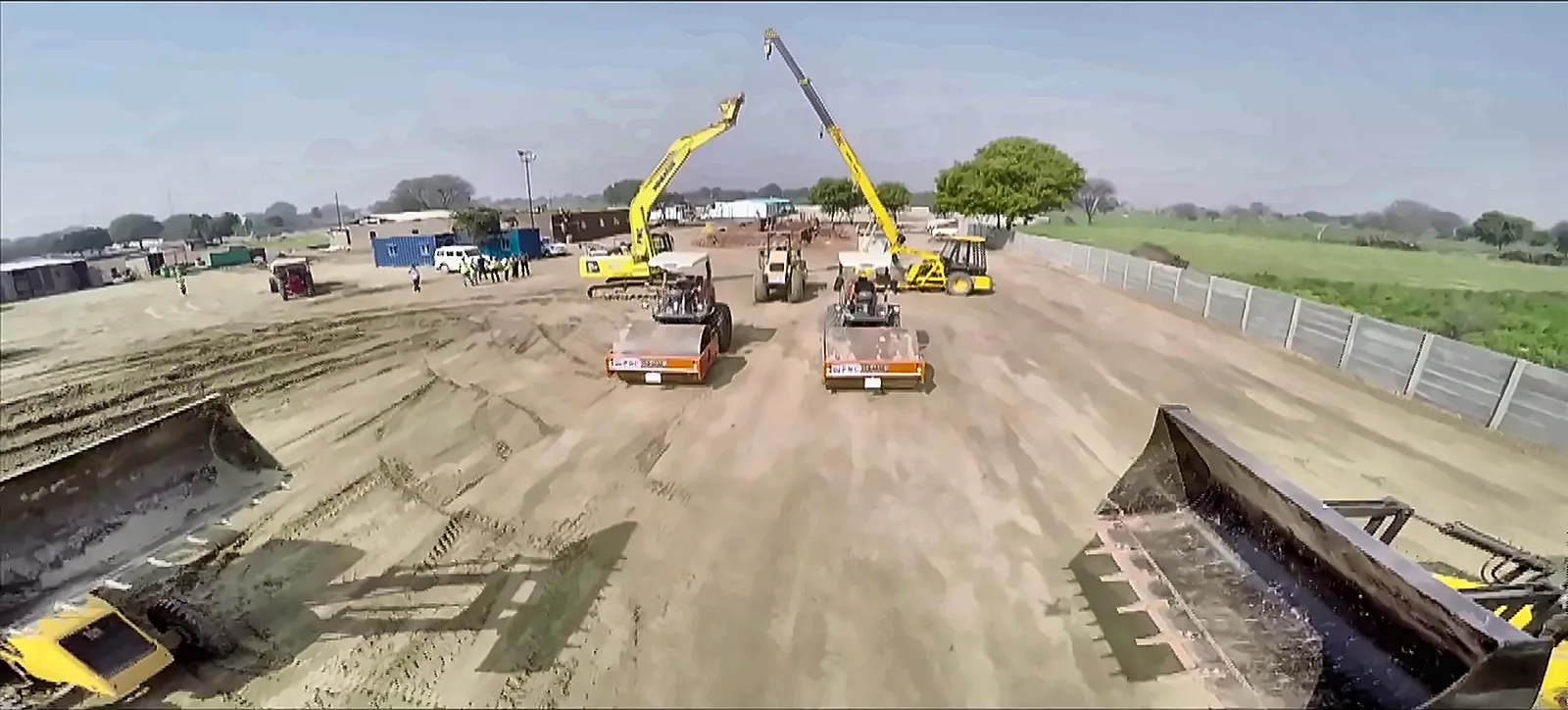 Excavators and earth-moving machines preparing a railway formation, from the IRCON International corporate film