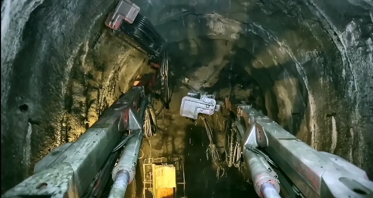 Drilling jumbo inside a railway tunnel under construction, from the IRCON International corporate film