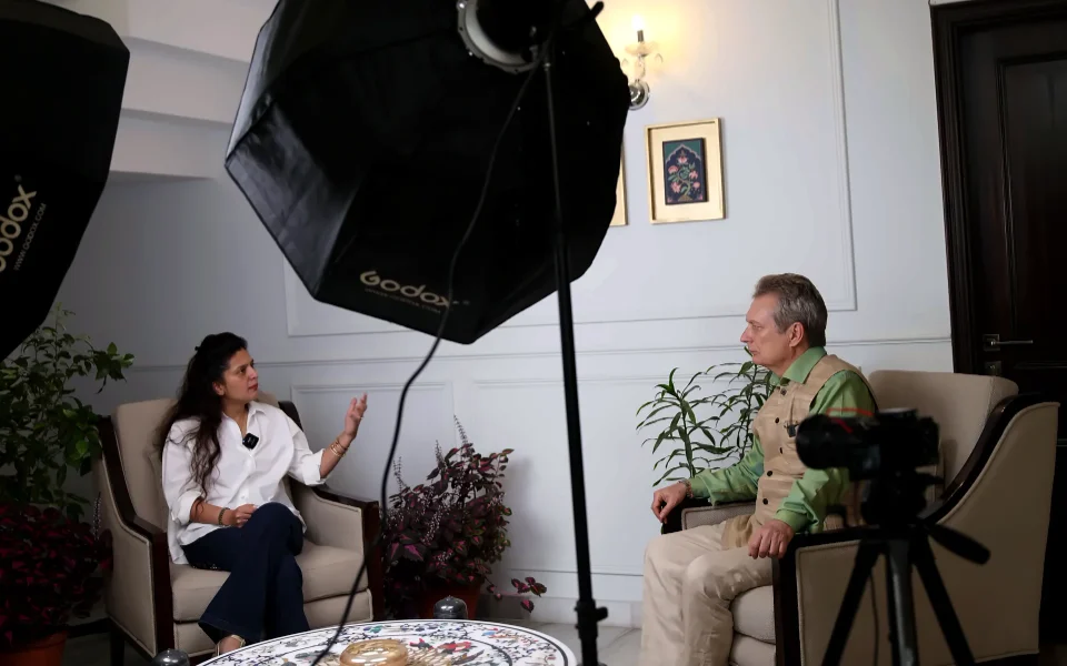Two-camera corporate interview in production with key lights and a monitored camera, Delhi NCR